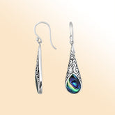 Silver teardrop earrings featuring Abalone Shell and ornate Bali scroll patterns.